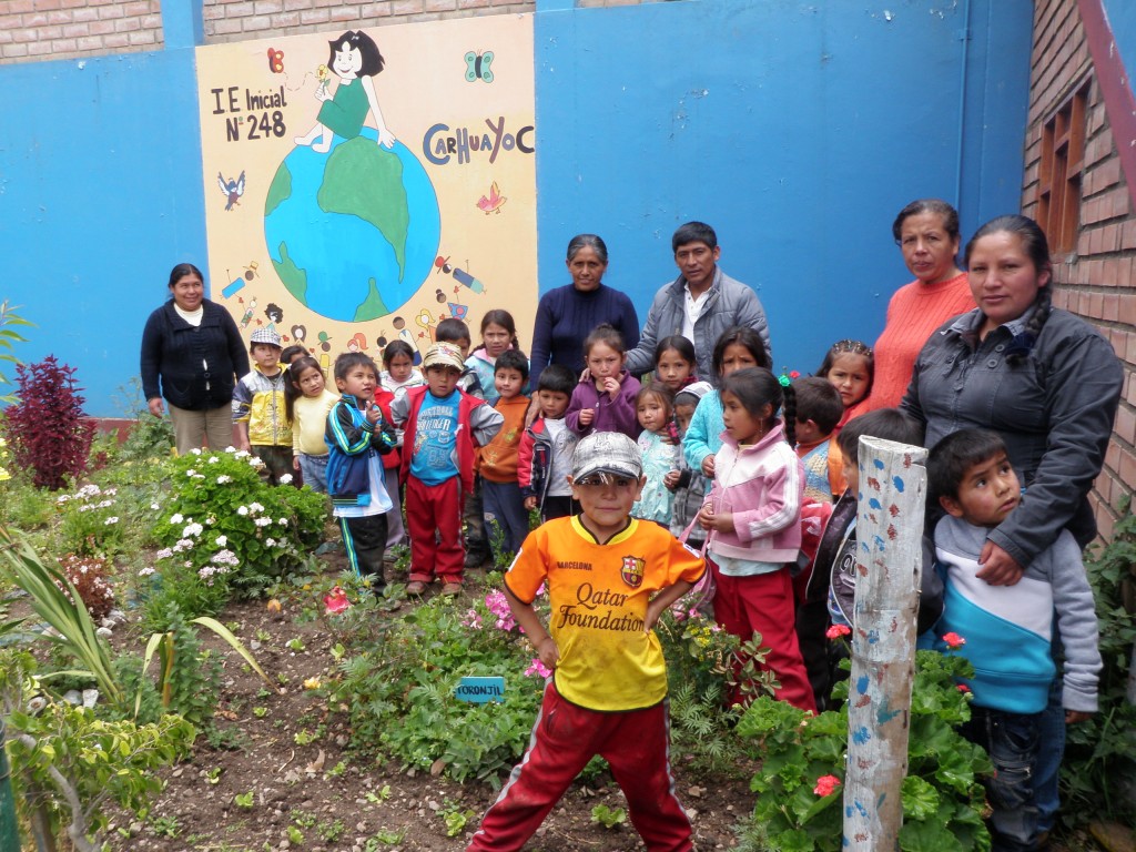 Children pose in their garden provided by TINI